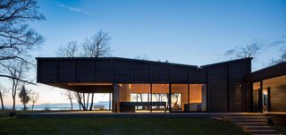 A Dramatic Cantilevered Roof Creates a Spacious Terrace Overlooking Lake Michigan - Photo 4 of 11 - The two sleeping quarters benefit from more solid facade than glass to provide adequate privacy. 