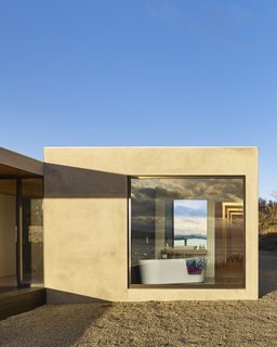 The aluminium-framed windows throughout are by Australian company Capral. "We wanted as<br>much glass as possible to enjoy the almost 360-degree views," says resident Sarah Younger. Styled by Julia Landgren