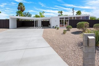 With polished-concrete floors, post-and-beam ceilings, and an open floor plan, this Alexander home designed by William Krisel in the Racquet Club Estates has a home theater, a newly renovated kitchen, and a private backyard that offers spectacular mountain views. Plus, it's just minutes from downtown restaurants and bars. 