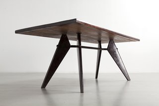 An Expanded Monograph Looks Back on the Life and Career of Modern Master Jean Prouvé - Photo 2 of 3 - Over the course of his life, he pursued design that addressed serious problems, such as emergency housing, and pioneered prefab manufacturing techniques to equip hospitals, schools, and offices with furniture and fittings of his own creation.</p><p><br> Jean Prouvé, S.A.M No. 506 Table ©Patrick Seguin