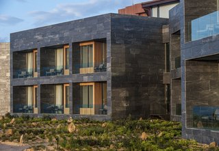 Spain's Basque Coast Gets a New Modern Hotel With a Michelin-Starred Restaurant - Photo 1 of 12 - This photo of Hotel Akelarre's exterior provides a look at the guest room terraces. 