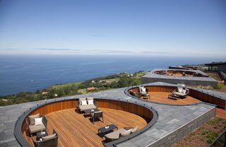 Spain's Basque Coast Gets a New Modern Hotel With a Michelin-Starred Restaurant - Photo 2 of 12 - A shared outdoor space with breathtaking views features six slightly sunken decks for lounging and conversation