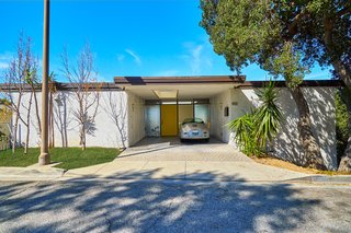 A Midcentury-Modern Home in L.A. Designed by Richard Banta Is For Sale For $899K - Photo 1 of 13 - This Richard Banta-designed midcentury home is located at 1031 Berlin Drive in Glendale, California. The two-bedroom, two-bath house measures 1,218 square feet and sits on a 3,030-square-foot lot.