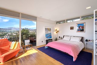 A Midcentury-Modern Home in L.A. Designed by Richard Banta Is For Sale For $899K - Photo 12 of 13 - The connection to the outdoors doesn't end when you leave the main living area, as you can see in this bedroom that also looks out to incredible views.