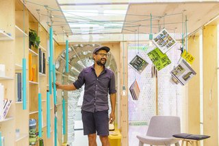 The home’s "library" features books hanging from the ceiling via a stylish turquoise counterweight. 