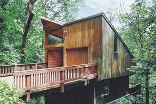 Though the tree house-inspired home is nestled in the middle of a dense forest, it's still only 10 minutes away from downtown Portland.