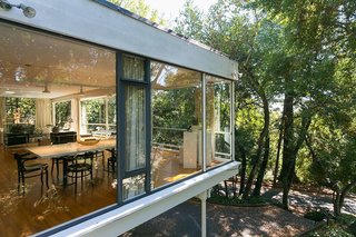 An Amazing Tree-Covered Glass House For Sale in the Berkeley Hills - Photo 2 of 20 - The cantilevered extension appears to float above the hillside.