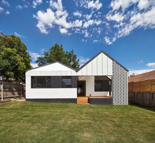 The 2,691-square-foot home was given an entire new roof and facade at the rear.
