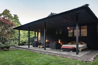 The portico is used as a living area in spring and summer.