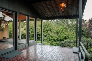Floor-to-ceiling windows illuminate the foyer.