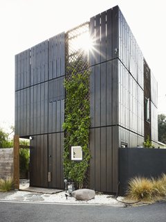 Working as designer, contractor, and builder, Samantha Mink took an unremarkable structure built in the 1950s and transformed it into a home for herself and her dog, Winston. "Because of its location on the street, I kept a kind of stern exterior where you can’t really see into the house," she says. She treated the Douglas fir with a natural mineral wash and an exterior stain to give the wood dimension.