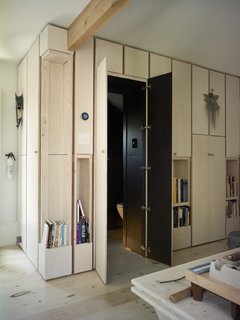 A new bathroom is tucked under the existing stair.