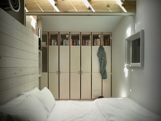 The bed sits atop a platform; above it is an HVAC vent.