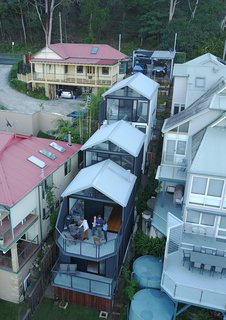 Only a Drone Could Capture How This House Fits on a Lot That’s Less Than 20 Feet Wide - Photo 1 of 4 - Referencing a boat shed, Emma Viljoen-Holmes and David Holmes' multi-level home near Sydney is made of a corrugated-steel roof and weatherboard siding. 