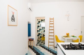 An Old Fisherman's House in Sicily Is Transformed Into 2 Apartments - Photo 1 of 12 - The now combined kitchen and dining space in the one-bedroom apartment is compact yet efficient.