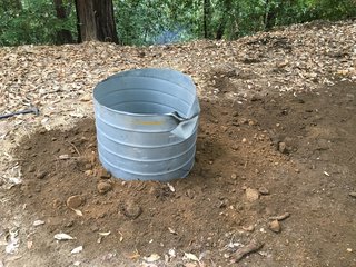 After cleaning up the hole, you can shore the top of it with an old piece of 32-inch diameter galvanized culvert that you can pick up at your local rebuilding center for cheap, and fill in around it.