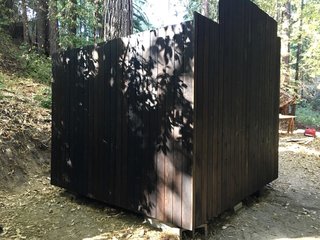 For the cube, the siding is a knotty, low-grade cedar, which is usually the cheapest cedar at the lumber yard. Waldman coated all the siding (front and back) with Swedish pine tar made by Auson. Pine tar is a traditional Scandinavian wood preservation treatment that's been used for a millennia or so. You mix it 50/50 with linseed oil and brush it on with a rag. Let it dry for a few days and you're good to go. It's non-toxic, incredibly durable, and frankly, when coupled with cedar, much more long-lasting than this structure deserves. 