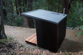 For the roofing felt, Waldman used a 30# roofing paper, layered from bottom to top, with regular roofing nails. The paper overhung the edges of the siding and was capped with the roof flashing. The bottom piece of eave flashing that covered the lowest part of the roof was installed first with roofing nails. The tar paper then lays on top of that. All the metal roofing came from a company called Metal Sales, and sold by a local distributor. Panels were cut to length by the vendor, but Waldman had to rip one to width with an angle grinder and trim the flashing with tin snips. 