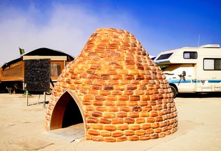 16 Otherworldly Photos of Burning Man Architecture - Photo 12 of 16 - The Loaf Shelter made of 850 loaves of bread