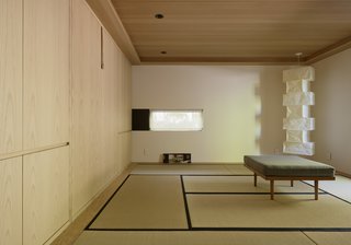 The new interior includes a meditation room with an Isamu Noguchi lamp, flooring made of tatami mats, and a Murphy bed for visitors. 