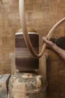 Watch: It Takes 9 Hours For Woodworkers to Make This Shaker-Inspired Chair - Photo 15 of 19 - Sand: A balloon sander fitted with 60-grit sandpaper smooths off the rasp marks, then the team uses 220-grit sandpaper to hand-sand the arm to a final finish. 