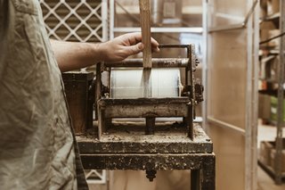 Watch: It Takes 9 Hours For Woodworkers to Make This Shaker-Inspired Chair - Photo 12 of 19 - Laminate: To make the signature continuous cherry arm,11 knife-cut slices from the same board are laminated together with glue to make one strong, flexible piece. 