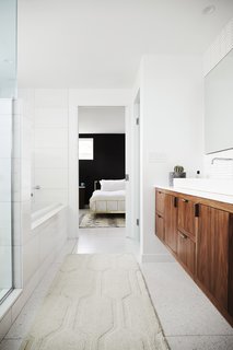 Midcentury Mashup: A 1950s Ranch House in Chicago Gets a Palm Springs-Style Butterfly Roof - Photo 9 of 15 - The master bathroom features Terrazzo tile from Terrazzio and American walnut cabinetry.
