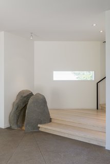 The Bunnings found the boulder that marks the entryway during the home’s excavation.