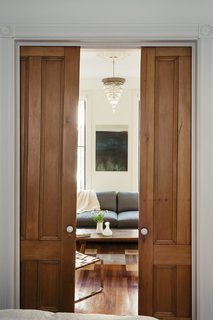 Self-taught designer Tom Givone fixed up his 1882 row house in New York City over many years. In the parlor, he uncovered pocket doors entombed in sheetrock.