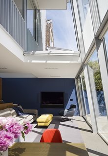After a Renovation, a Classic San Francisco Victorian Is Now Bursting With Light and Color - Photo 5 of 15 - Working with project architect Todd Aranaz, Fougeron moved the living room to the ground floor and combined it with the dining area and kitchen. The Stoccolma sofa and ottoman <br>are by Paola Navone for Baxter. 