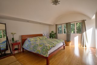 The main bedroom has a generous closet and outdoor access.