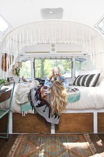 Due to the lack of space, the couple have quickly learned to maximize every inch of storage space. For instance, Sheena uses vintage clips on the walls to stylishly hold papers and photographs.