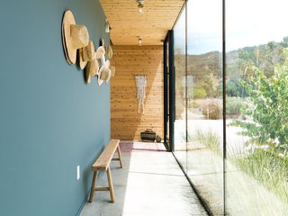 Wall space in a hallway can easily be activated by a series of hooks for hats, coats, or scarves. If the hallway is particularly visible, you may hang items in an artful way, so that there's a mixture of aesthetic cohesion and functionality.