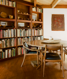 Legendary Textile Artist Kay Sekimachi’s Renovated Berkeley Victorian Is a True Creative Haven - Photo 3 of 6 - The dining table and chairs were a wedding present from Maloof to Stockdale, his best friend. Stockdale's finished bowls are arranged on the bookshelf. 