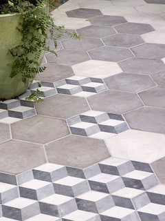 The floor tiles, which create a seamless transition from kitchen to patio, are from the Illustrate line by Solus.