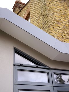 Above the kitchen extension, Rivera installed a peaked roof and, as part of the new design, placed a triangular window that follows the roofline. "I remember looking at that little triangle, which was quite expensive, and thinking, is it really necessary?" says Andrew. "But Helena said, ‘Just trust me, you should do this.’ And of course, it looks so much better this way than it would have without it."