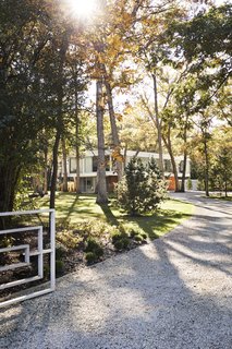 Once Covered in Mold, a Midcentury Gem Outside Chicago Is Reborn - Photo 1 of 15 - Taking an active role in the restoration of a midcentury house she and her husband bought near Chicago in 2013, Eva Kowalow honored the vision of the home’s architect and previous owner, Jack Viks, while updating the structure to fit her style and the needs of her family. The entrance gate, designed by Viks, is original.