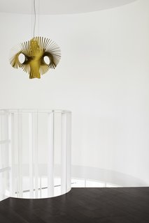Once Covered in Mold, a Midcentury Gem Outside Chicago Is Reborn - Photo 7 of 15 - A Minimikado light from Lzf Lamps hangs at the top of the staircase. 
