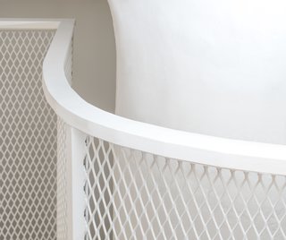Designers Jaffer Kolb and Ivi Diamantopoulou had to contend with the apartment’s two giant <br>columns. The loft’s outline conforms to one of them.