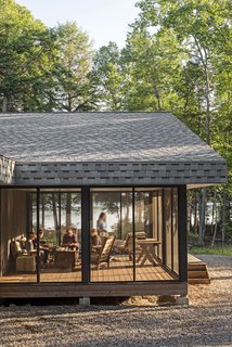 The cottage stretches for more than 110 feet, with a Muskoka room, or screened-in porch, at the northwestern end.