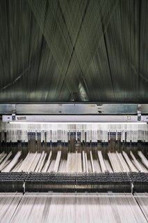 <b>6 Prepare the Loom</b> The Tidal Wave pattern is woven using a Jacquard loom, a machine that dates to 1804. Today, MTL uses a computer file that acts as the loom’s "brain" and controls the binary weaving process. 