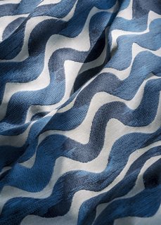Each finished run of Tidal Wave fabric is stretched across a frame and carefully inspected for imperfections. Any textile that doesn’t meet industry standards is either repaired or, in rare cases, scrapped, depending on the severity of the flaw. Once the fabric passes inspection, it is sent to the warehouse to be sold or made into pillows.