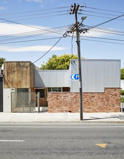 This DIY Home in New Zealand Doubles as a Coffee Spot and Art Gallery - Photo 2 of 16 - "The project reverses the traditional suburban pattern of a house centered on its site and surrounded by empty space," says Beer. Instead of a lawn, it has three courtyards behind a brick wall.
