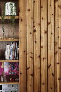 This DIY Home in New Zealand Doubles as a Coffee Spot and Art Gallery - Photo 13 of 16 - <b>Cabinetry: </b>The owners’ biggest savings came from building the cabinetry themselves. Because the house has no garage, the couple wanted lots of indoor storage, which they mostly hid behind flush, full-height "second-grade" cedar doors.