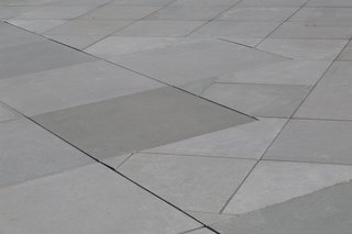 Paving the Way For Iconographic Landmarks - Photo 11 of 17 - Precast Concrete Roof Pavers are available in 12 standard colors and a variety of finishes. Pedestal set pavers mimic a roof's slope to allow for free flowing drainage.