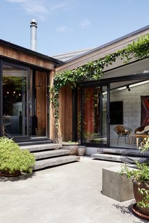 Ample greenery in the courtyards softens the neutral material palette.