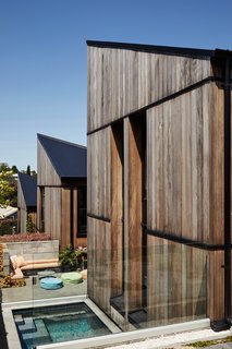 Buffalo Construction and engineering firm HFC Group worked with Rich to build the 3,000-square-foot home. The exterior is clad in western red cedar and the roofs are black factory-painted galvanized corrugated steel. 