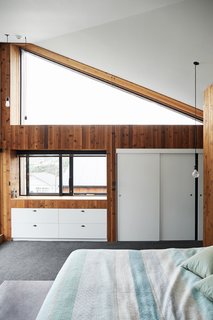 In the master bedroom the high triangular window is "excellent for stargazing," says Rich. 