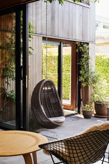 "Garden rooms" on the first and second level connect the hallway to the courtyards via large sliding glass doors. 