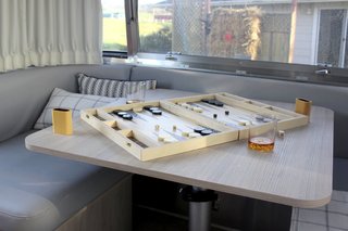 The dinette converts to a sleeping area at night. 